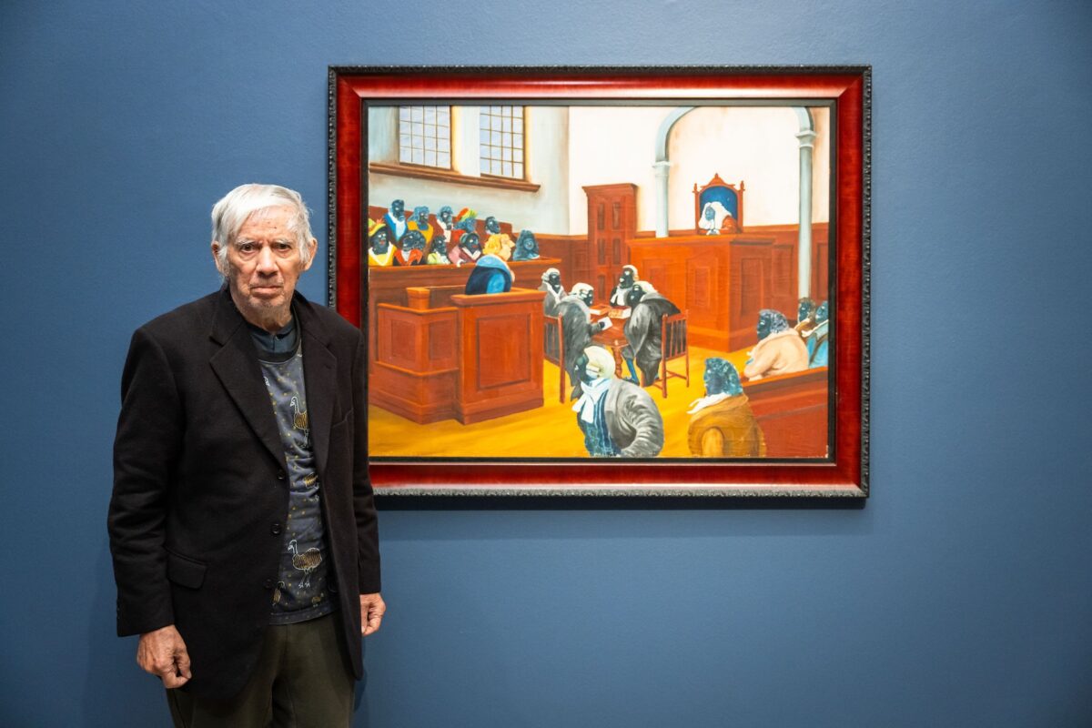Uncle Gordon Syron stands beside his painting Judgement by His Peers 1978 which is on display at Heide Museum of Modern Art as part of the exhibition Blak In-Justice: Incarceration and Resilience' presented by The Torch and Heide