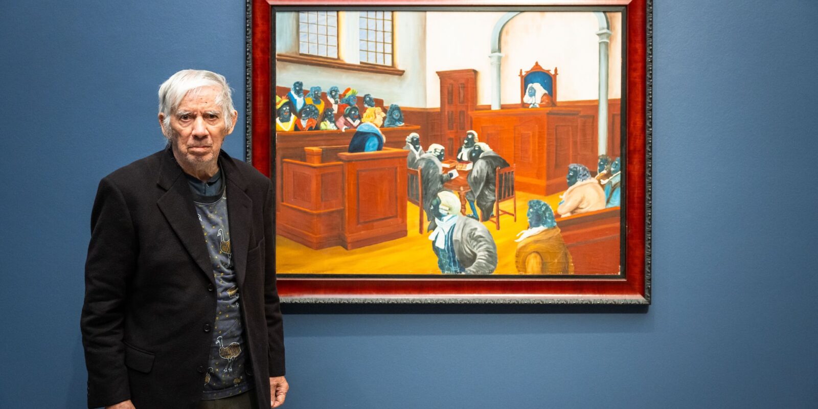 Uncle Gordon Syron stands beside his painting Judgement by His Peers 1978 which is on display at Heide Museum of Modern Art as part of the exhibition Blak In-Justice: Incarceration and Resilience' presented by The Torch and Heide